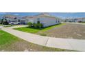 Well-maintained home with a two-car garage, driveway, and landscaping at 820 Overpool Ave, Davenport, FL 33896