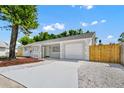 Beautifully renovated single-story home boasting a freshly painted exterior, new driveway and updated landscaping at 4710 Hatteras Ct, Orlando, FL 32808