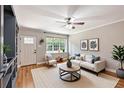 Bright living room with hardwood floors and a neutral color palette, great for entertaining at 125 E Miller St, Orlando, FL 32806