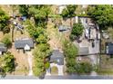 Aerial view of the property showing the house, outbuildings, and landscaping at 131 Autumn Ct, St Cloud, FL 34771