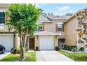 Charming townhome featuring a one car garage, wooden shutters and a cozy front porch at 207 Sterling Springs Ln, Altamonte Springs, FL 32714