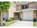Charming townhome featuring a one car garage, wooden shutters and a cozy front porch at 207 Sterling Springs Ln, Altamonte Springs, FL 32714
