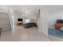 Bright living room with high ceilings, tile flooring and neutral tones at 2889 Blooming Alamanda Loop, Kissimmee, FL 34747