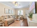 Comfortable living room showcasing stylish sofa, contemporary decor, and TV at 2952 Lucayan Harbour Cir # 106, Kissimmee, FL 34746