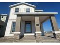 Charming home featuring a covered porch with stone accents and a welcoming facade at 5330 Center Lake, St Cloud, FL 34771