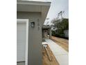 Exterior of new construction home featuring a walkway, gray paint, and the house number 563 at 563 Winogene Ave, Umatilla, FL 32784
