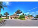 Community clubhouse provides residents with a gathering space and various amenities amidst lush landscaping at 8110 Princess Palm Ln, Kissimmee, FL 34747