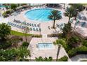 Expansive community pool area with ample seating and a relaxing spa, ideal for residents to enjoy at 1425 Thunderbird Rd, Davenport, FL 33896