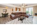 Comfortable living room with modern furnishings, ceiling fan and view into the kitchen at 150 Waterfall Way # 102, Altamonte Springs, FL 32714
