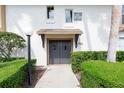 Inviting condo exterior featuring neatly manicured hedges and neutral tones at 200 Maitland Ave # 224, Altamonte Springs, FL 32701