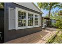 Exterior of home featuring multi-paned windows, crisp shutters and natural wood porch at 2020 Palmer St, Orlando, FL 32803