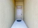 The front door offers both privacy and curb appeal, inviting guests into the home at 2636 Grand Central Ave, Tavares, FL 32778