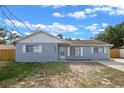 Inviting single-story home with a fresh exterior, white trim, and a neatly kept lawn at 2763 E Waco Dr, Deltona, FL 32738