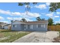 Well-maintained single-story home with a concrete driveway and fresh exterior paint at 2763 E Waco Dr, Deltona, FL 32738