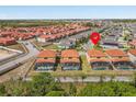 Aerial view showcases a community with tile roofs and screened-in pools, providing a serene and private backyard retreat at 411 Cabello Dr, Davenport, FL 33837