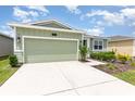 Well-maintained home with a spacious driveway and lush landscaping at 4351 Finch Ln, Kissimmee, FL 34746