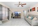 Spacious living room featuring marble floors and a cozy seating area at 507 Raymond Ave, Frostproof, FL 33843