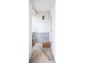 Covered entryway features a quaint, welcoming space with stone accents and an outdoor light fixture at 704 Beverly Ave, Altamonte Springs, FL 32701