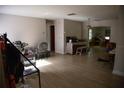 Spacious living room with wood-look flooring and ample natural light, ready for your personal touch at 704 Beverly Ave, Altamonte Springs, FL 32701