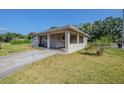 Charming single-story home featuring a carport, and well-maintained lawn at 72 Campus View Dr, Orlando, FL 32810