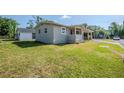 Charming single-story home showcasing a well-manicured lawn at 72 Campus View Dr, Orlando, FL 32810