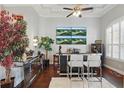 Modern bar area with a sleek counter, comfortable seating, and elegant decorative features at 841 Oaks Shores Rd, Leesburg, FL 34748