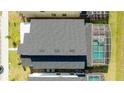 Aerial view of the home's roof, enclosed pool, and neighboring properties at 9332 Sommerset Hills Dr, Davenport, FL 33896