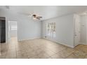 Open-concept living space featuring tile floors and a view to the front yard at 1051 Arden St, Longwood, FL 32750