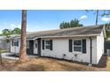 A well-maintained house featuring manicured landscaping and charming exterior details at 14120 Rutgers Ave, Orlando, FL 32826