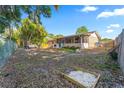 Expansive backyard featuring a patio, lawn area, and room for outdoor activities and entertaining at 1620 Carolyn Ct, St Cloud, FL 34769