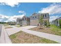A quiet residential street showcases a row of modern two-story homes with well-kept lawns at 264 Hayley St, Winter Haven, FL 33884
