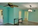 Open living room showing connection to additional room in the home at 3586 Eversholt St, Clermont, FL 34711