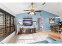 Inviting living room with blue walls, a fireplace, and stylish decor at 43825 State Road 19, Altoona, FL 32702