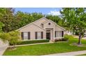 Well-maintained one-story home with manicured lawn and mature trees at 530 Hiawatha Palm Pl, Apopka, FL 32712