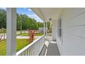 Inviting front porch view with decorative plants at 6148 Landrace Ln, Orlando, FL 32807
