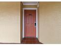 A cozy condo with a terracotta-colored door, a digital lock and matching tile entryway at 6402 Parc Corniche Dr # 5304, Orlando, FL 32821