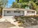 Well-maintained single-story home with fresh exterior paint and tidy landscaping at 75 Garrison Ln, Frostproof, FL 33843