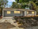 Well-maintained single-story home with fresh exterior paint and tidy landscaping at 75 Garrison Ln, Frostproof, FL 33843