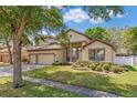 Charming two-story home with a three-car garage and well-manicured landscaping at 902 Hire Cir, Ocoee, FL 34761
