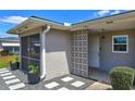Close-up exterior shot featuring a decorative breezeway and freshly landscaped entrance at 11137 Acme Dr # 207A, Orlando, FL 32825