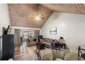 Cozy living room with vaulted wood ceiling, comfortable seating, and natural light at 1333 Villa Ln # 47, Apopka, FL 32712