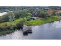 Beautiful lakefront home with a private dock and swimming pool, nestled in a serene, wooded landscape at 13377 Lake Butler Blvd, Winter Garden, FL 34787