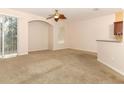 Living room with sliding glass doors, ceiling fan and neutral carpet at 2530 San Jacinto Cir # 2530, Sanford, FL 32771