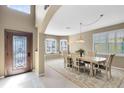 Elegant dining room with neutral color palette, decorative rug, and plenty of natural light at 2704 Gorst Rd, Winter Garden, FL 34787