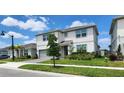 Charming two-story home with a manicured lawn, beautiful landscaping and gray siding at 4336 Foggy Oak Ln, Sanford, FL 32773