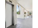 Hallway view of ground floor elevator access at 446 Bouchelle Dr # 103, New Smyrna Beach, FL 32169