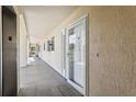 Hallway view of ground floor condo entrances with elevator access at 446 Bouchelle Dr # 103, New Smyrna Beach, FL 32169