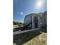 Condo exterior with stairs leading to an upper level balcony and entrance at 4772 Walden Cir # 228, Orlando, FL 32811