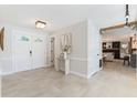 Inviting foyer with tiled floors, stained glass door accents, and modern decor at 5100 La Croix Ave, Belle Isle, FL 32812