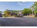 Community center with fountain, mature trees, and well-maintained landscaping at 5953 Westgate Dr # 1823, Orlando, FL 32835